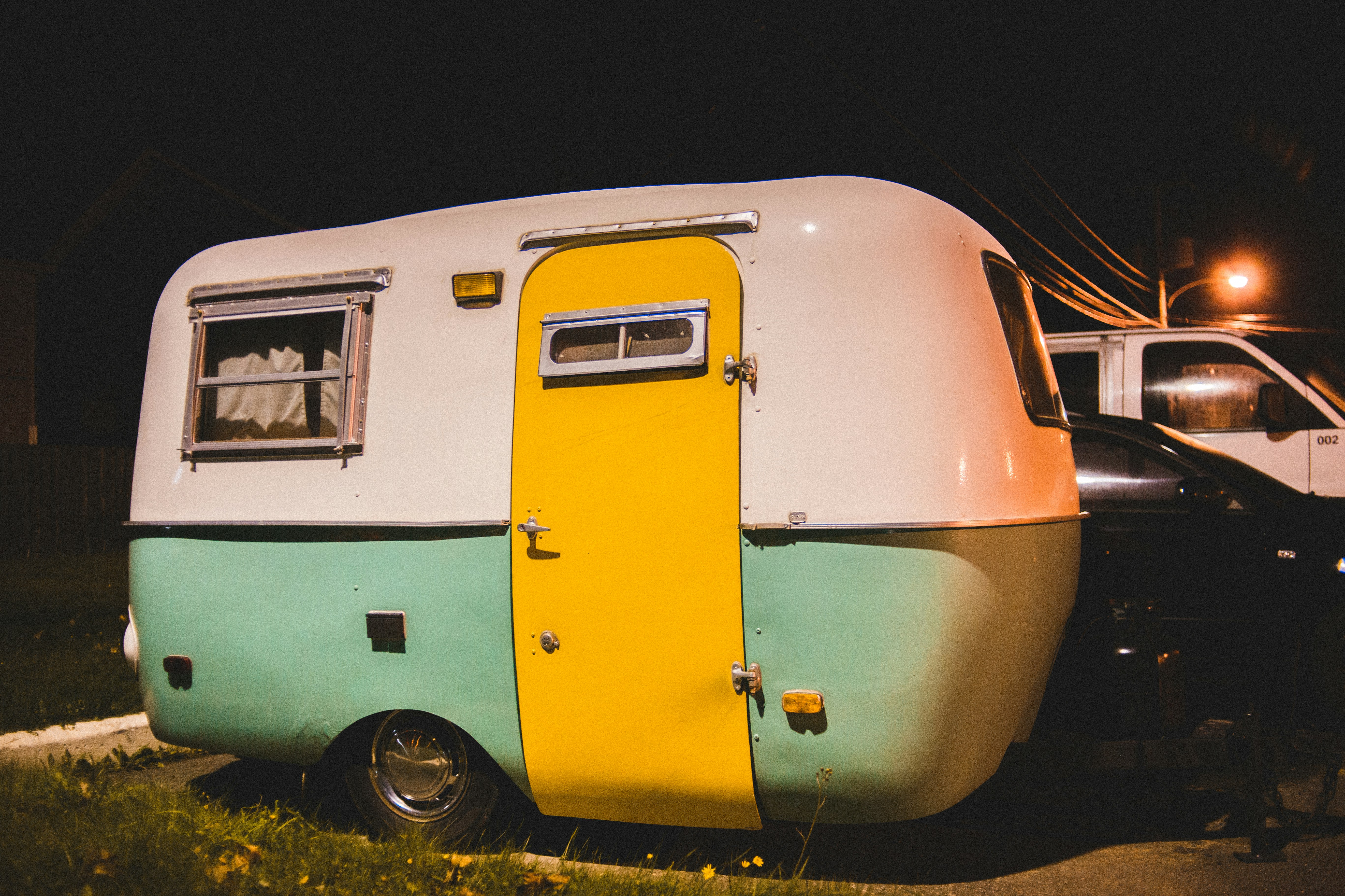 white and green camper trailer